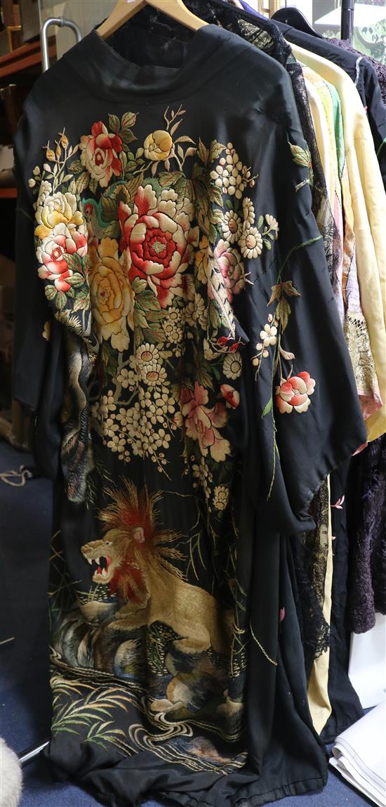 A black silk embroidered kimono, embroidered with flowers and a lion